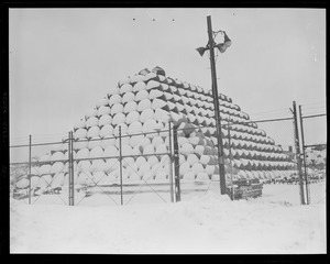 Stacked buoys covered in snow