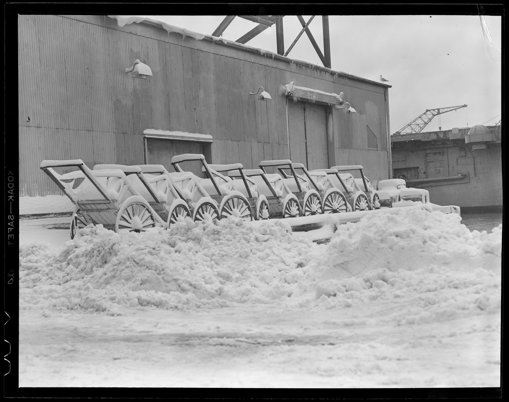 Snow covered hand carts, Boston waterfront