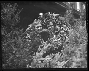 Women with Christmas wreaths