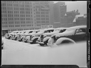 Cars covered with snow