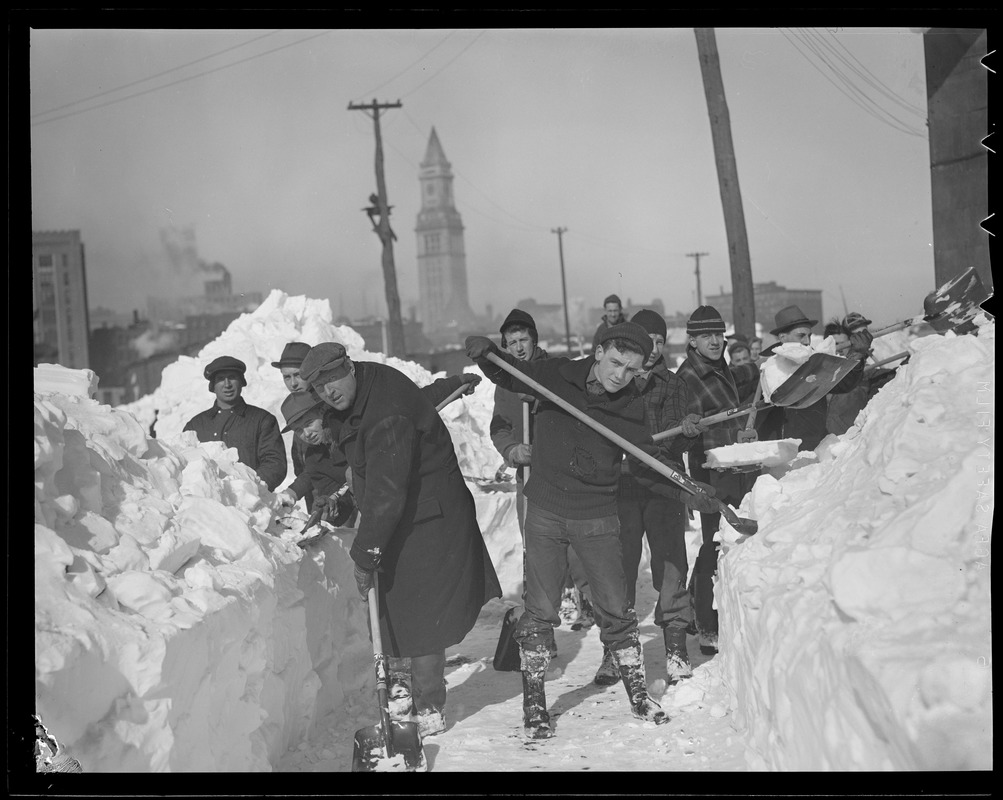 Crew digging out snow drift