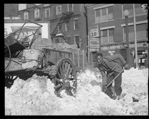 Colored man digging out horse and cart