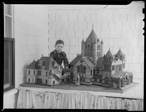 Boy examines model of Trinity Church