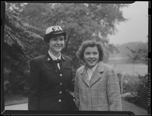 Family pride was a mutual affair yesterday on the Wellesley college campus as Lt. Commander Mildred H. McAfee, left, head of the Waves, was greeted by her sophomore niece, Harriet McAggee Brown of Binghamton, N.Y.