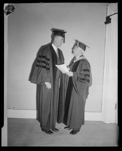 Two men at graduation ceremony