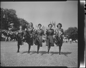 Women in uniform doing a little dance step