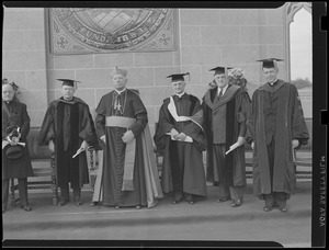 Boston College: receiving honorary degrees with President William J. Murphy and Cardinal O'Connell presiding. Left to right: Rt. Rev. Robert P. Barry, Directory of Catholic Charities Bureau; Cardinal O'Connell; Rev. James M. Gillis, editor of Catholic World; Dr. Joseph S. Stanton, Newton Surgeon; [unknown]; Rev. William J. Murphy.