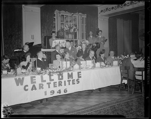 Sign on table says "Welcome Carterites, 1946" for Carter Hotels dinner at Hotel Avery
