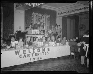 Sign on table says "Welcome Carterites, 1946" for Carter Hotels dinner at Hotel Avery