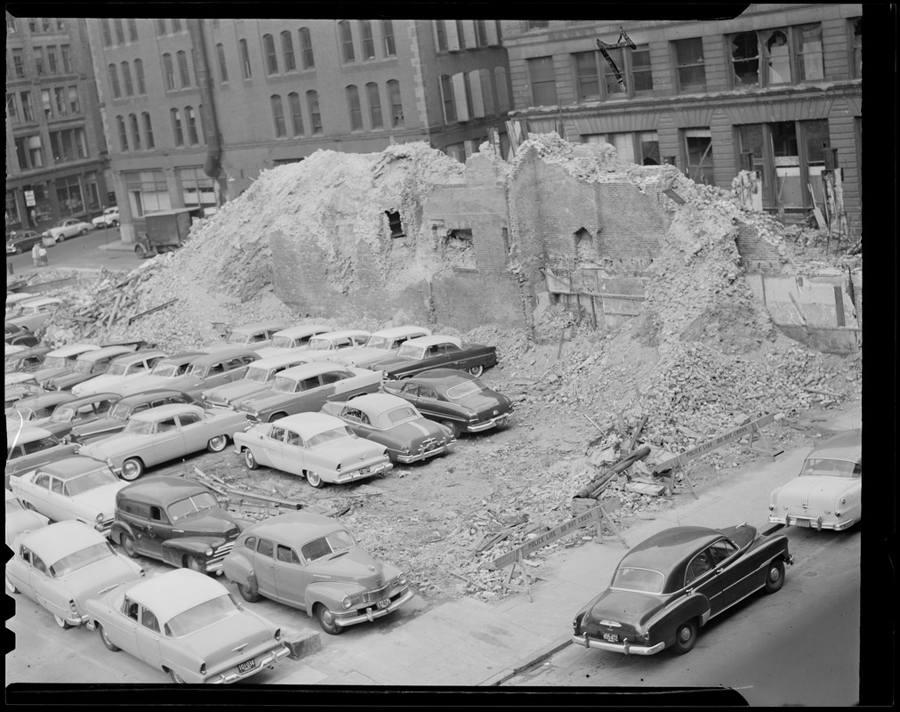 Autos parked in lot left by demolished building