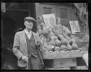 Man selling pineapples