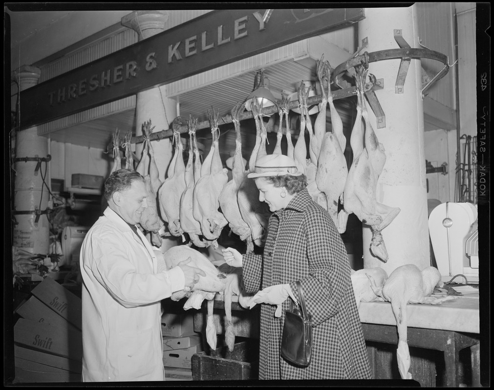 Mr. Kelley selling a Thanksgiving turkey, Thresher & Kelley Market, Faneuil Hall