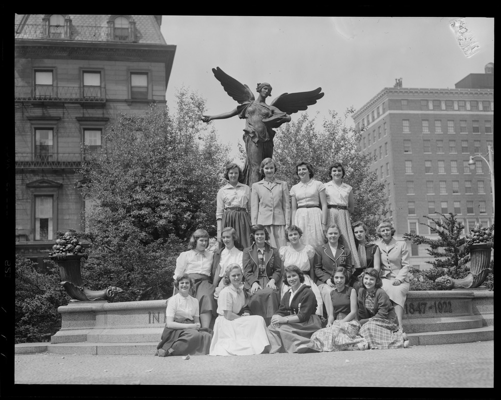Group of women pose in front of the George Robert White Memorial, Public Garden