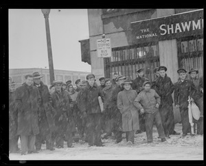 Northern Ave., near fish pier, crowd, sailors in front of the National Shawmut Bank - removed 2003, snowing(?)