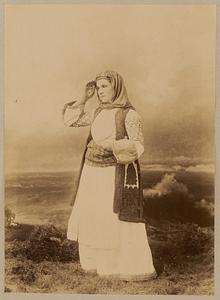 Studio portrait of woman in traditional Greek dress