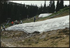 People playing on snowy slope, Colorado