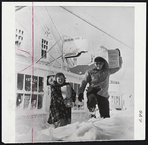 Plowing Through Snow For Groceries are Milton Welt and his daughter, Drusilla, as they leave a Chatom grocery store.
