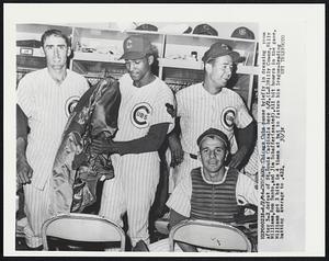 Chicago: Chicago Cubs pause briefly in dressing room after 5-2 defeat of St. Louis Cardinals here 6/2. (L-R) Billy Cowan, Billy Williams, Ron Santo, and Jim Schaffer (seated). All hit homers in the game. Williams got 3 hits in 4 times at bat to fatten his league-leading batting average to 422.