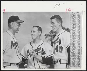 On the Same Side Now-Rightstanders Bob Rush, at left, and Don Kaiser, right, who came to Milwaukee Braves in winter deal with Chicago Cubs, pose with new teammate, pitcher Warren Spahn, at Braves camp today. Rush, 32, spend 10 years with Chicago where he had a lifetime mark of 110 wins and 140 losses with a second-division team. His 1957 record was 6-16. Kaiser, 22m is former bonus boy. He split last season between Cubs and their Portland, Ore. farm. It is expected Rush will bolster pitching strength of the Champion Braves. Signed batterymen reported as camp opened today.