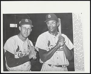 Not at End of Career- Stan Musial, left poses with teammate George Crowe before the St. Louis Cardinals' game with the Philadelphia Phillies last night and Musial remained on the bench while Crowe took over first base. Cards' Manager Solly Hemus said it was "absolutely not" a hint that the 39-year-old first baseman's long career was approaching its end. Musial agreed. Hemus said benching Musial was just a day-to-day basis.