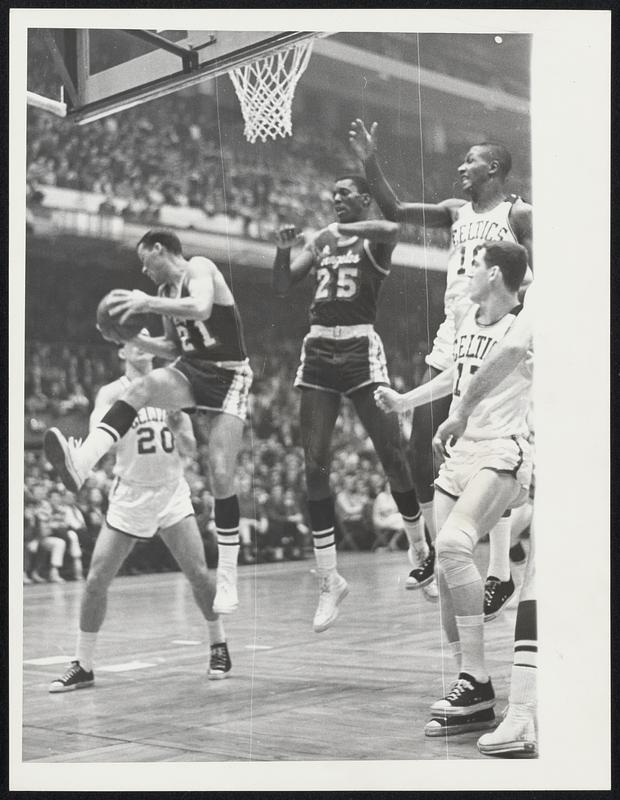 Los Angeles Lakers Jim King And Leroy Ellis Leap For A Rebound 