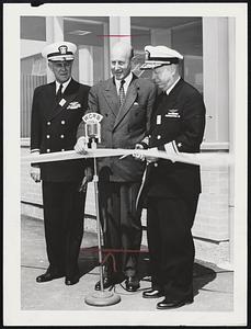 Ribbon Cutting for official opening of Raytheon Mfg. Company's new missile and radar development laboratory at Bedford yesterday. Left to right, Rear Adm. Charles B. Momsen, commandant of First Naval District; C. F. Adams, Jr., president of Raytheon; Rear Adm. R.S. Hatcher, of Scientific Research and Development, Bureau of Aeronautics, U.S. Navy.