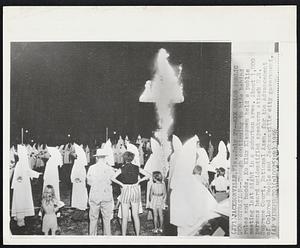 KKK Holds Public Demonstration--Though continuing to hide behind robes and hoods, Ku Klux Klansmen held a public meeting last night in a suburban area. About 1,000 persons heard unidentified speakers attack U.S. Supreme Court, National Assn. for the Advancement of Colored People and Jacksonville city government.