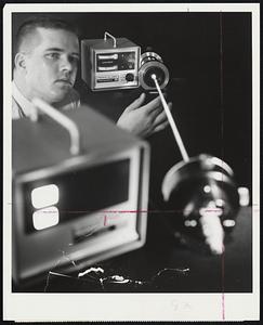 Submarine Builders at the Electric Boat division of General Dynamics are getting the job done faster, better, and cheaper these days thanks to the alignment, calibration, and tooling capabilities of the laser. Above, Dick Muckle, methods analyst, calibrates laser for shaft alignment job on nuclear attack submarine.