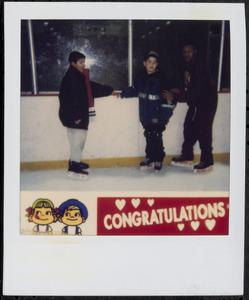 Trio of boys ice skating