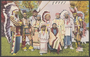 A family of West Plains Indians with grandmother and granddaughter in foreground