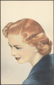A red-headed woman looking downwards, three-quarter profile