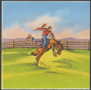 Cowboy riding bucking horse