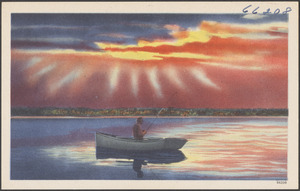 Man fishing in a boat on a lake
