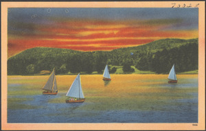 Sailboats on lake, hills in background