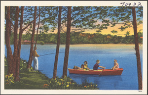 A group in a boat on a lake by a man fishing on shore