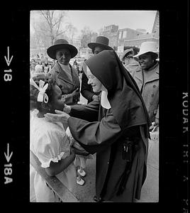 Nun greets black girl on Easter Day, Boston