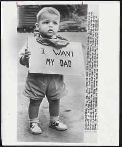 Puts in Word for Dad--David Lee Poston, 2, carries a sign in behalf of his dad, Sgt. Henry Poston who is serving in Korea, as 20 wives, mothers and their children picketed the Missouri National Guard armory here today to attract attention to demands that their men, members of the 106th Ordnance Company now stationed at Pusan, Korea, be released on the same basis as reservists.