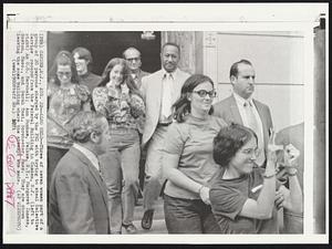 Also Held--Three of seven women part of a group of 20 persons charged by the FBI with trying to steal Selective Service records from the Federal Building in Camden, N.J. (left to right) An U.S. Marshall; Ann Dunham, Pelham, N.Y.; Margaret Innes, Boston, Mass., and Sarah Tosi, Dorchester, Mass. They are shown leaving the same building where the attempt was made.