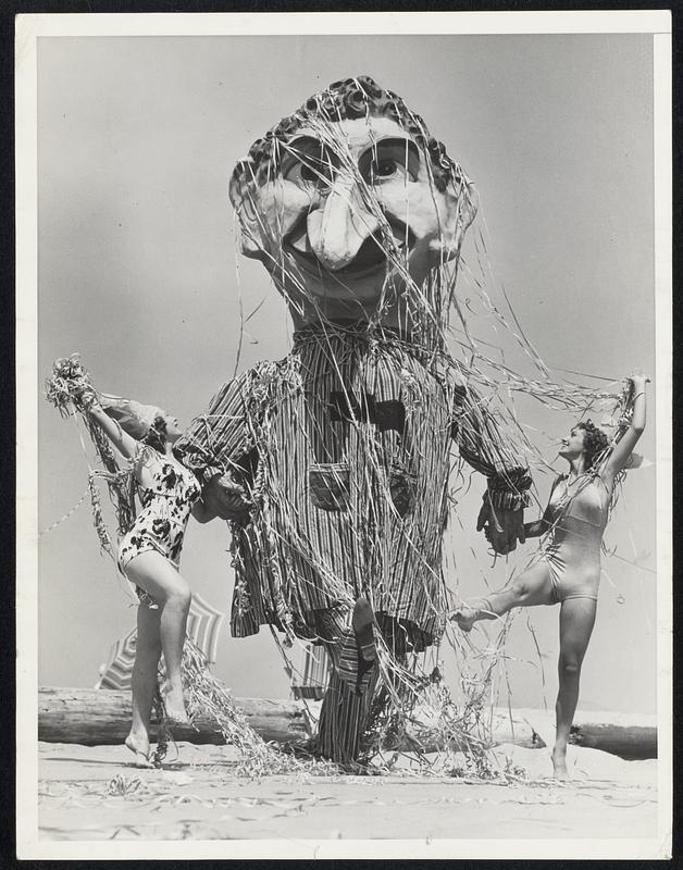 "We've Got Something!" It may take time and money and quite a bit of patience to build up a silly looking thing like this, but these Venice, Cal., bathing girls who took part in the recent seaside Mardi Gras festival appear to be enjoying speaking acquaintance at least with this masque. They are Gwenn Verdon (left) and Margie Goyette.