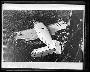 Plane Esa: Transatlantic flyers rescued at sea. Camera on SS Belmoira caught this dramatic photo a moment before rescue. The SS Strvangerfjord took them to N.Y. Men: Willy Rody/Christian Johannsen/Fernando Costa Viega