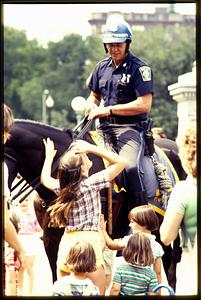 Boston - Boston Common : A mounted patrol officer of the Boston Police talks to children, 1982