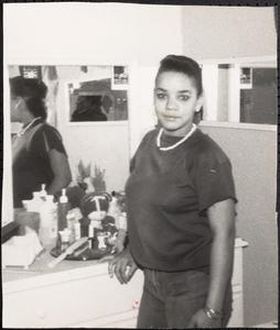 Maria Preston posing by a dresser