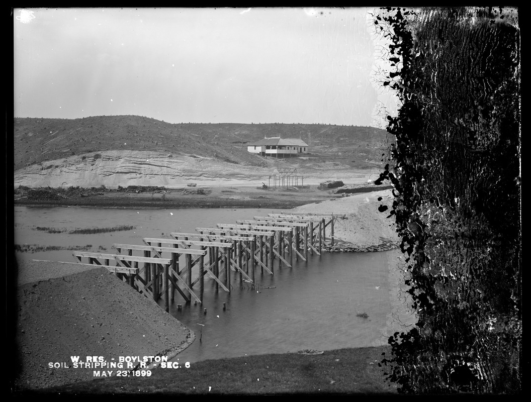 Wachusett Reservoir, pile trestle and embankment of soil stripping railroad, Section 6, from the south. Cunningham's pavilion in background, Boylston, Mass., May 23, 1899