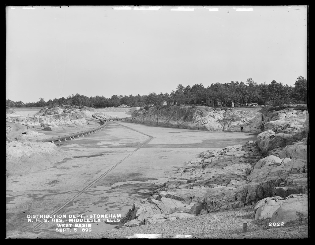Distribution Department, Northern High Service Middlesex Fells Reservoir, west basin, from the north, at Dam No. 2; before filling, with concrete bottom and pipe line, Stoneham, Mass., Sep. 5, 1899
