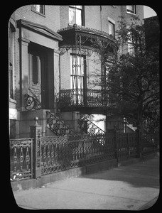 Lacy iron fence and balcony at seven Monument Square