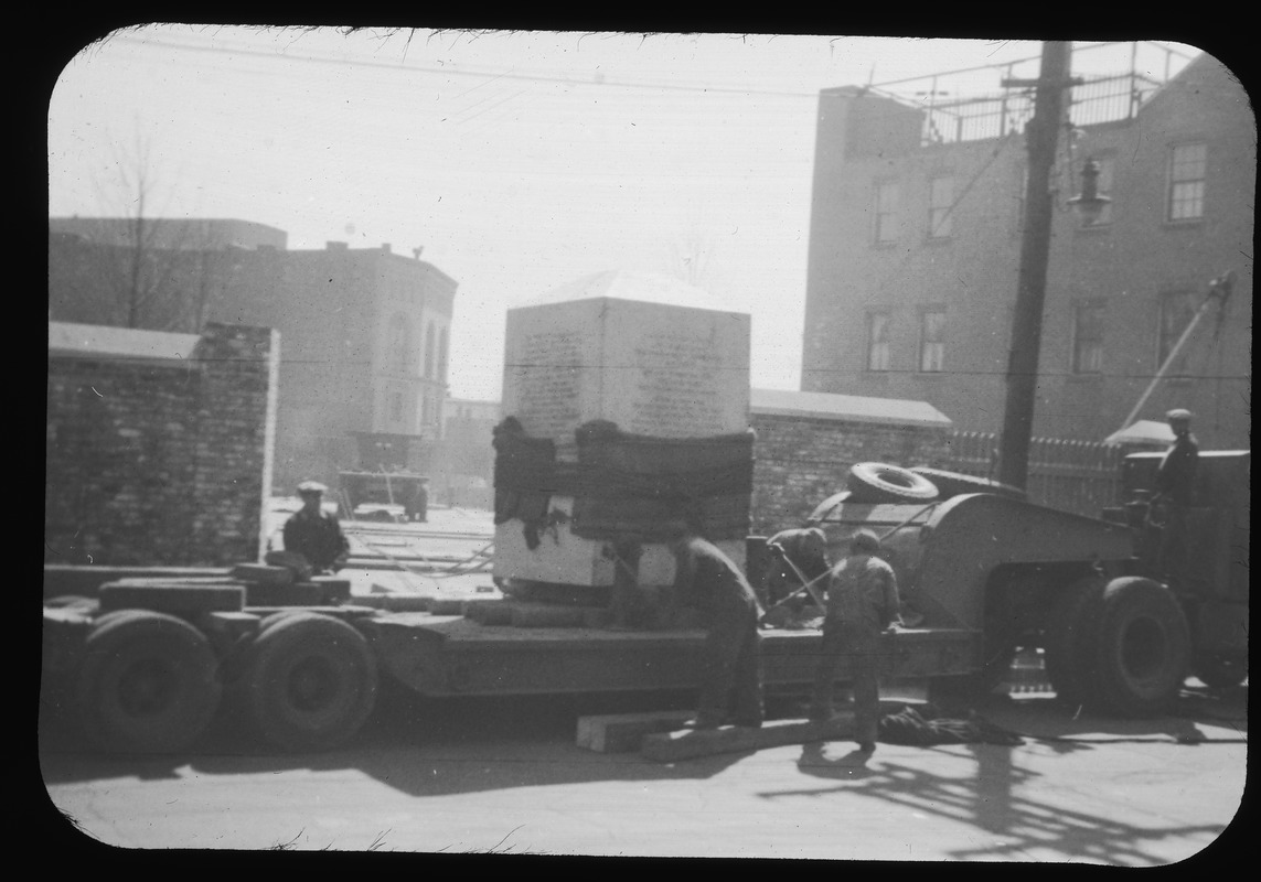 Unloading of 17 ton granite base for flag pole