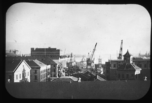 Navy Yard shops and waterfront as seen from Mystic Bridge. Dec. '49.
