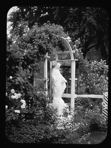 Virgin Mary statue in garden, Charlestown, Mass.