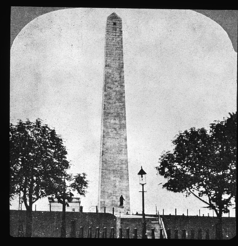 Monument with what appears to be the original wooden lodge moved to a temporary position during the construction in 1900 of the present stone lodge