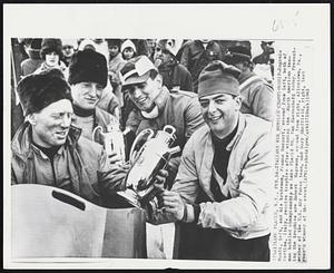 Italians Win Bobsled Championship-Eugenio Monti, left, and his brakeman, Franco Gaspari, second from left, both of Cortina, Italy, receive trophies after winning the North American two-man bobsled championship on Lake Placid Mt. Van Hoevenberg today. Presenting the trophies are Robert Hagemus, second from right, Allentown, Pa., member of the U.S. Air Force team, and Gary Sheffield, right, last year's winner of the event.
